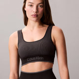 Calvin Klein Medium Impact Womens Sports Bra Black, front view showing ribbed design and logo at the hem.