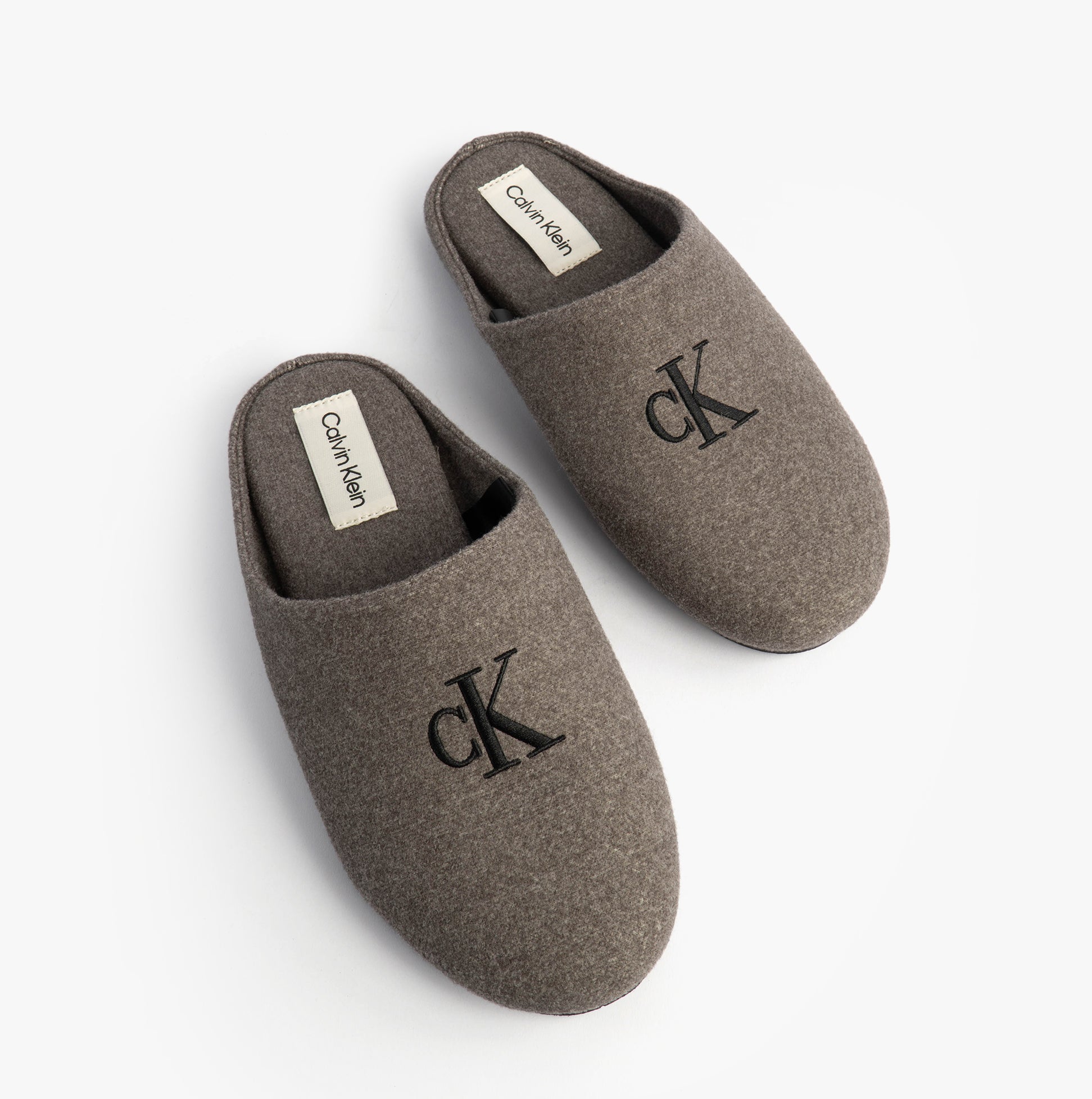 Calvin Klein Mens HOME Felt Signature Logo Mule Slippers Grey top view showing soft felt material and round toe design.