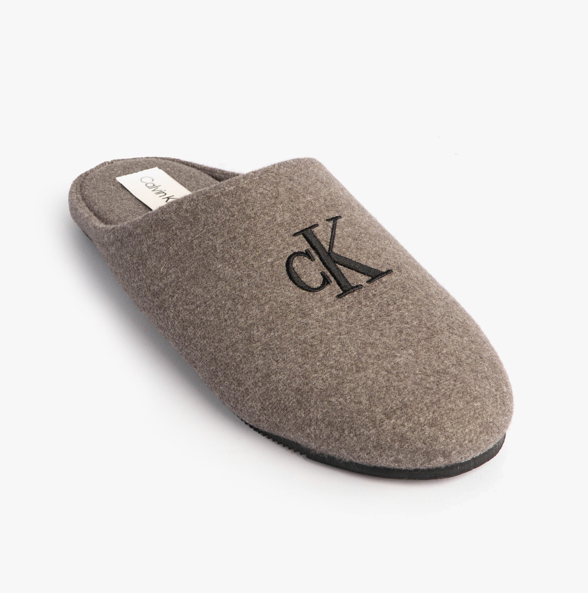 Calvin Klein Mens HOME Felt Signature Logo Mule Slippers Grey side view showing the soft felt upper and logo detail.