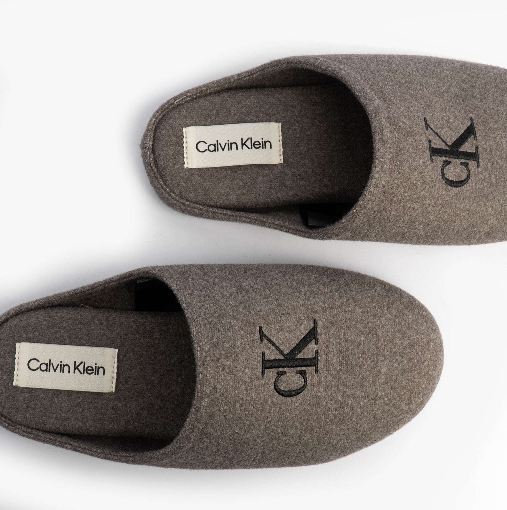 Calvin Klein Mens HOME Felt Signature Logo Mule Slippers Grey top view highlighting logo and design.