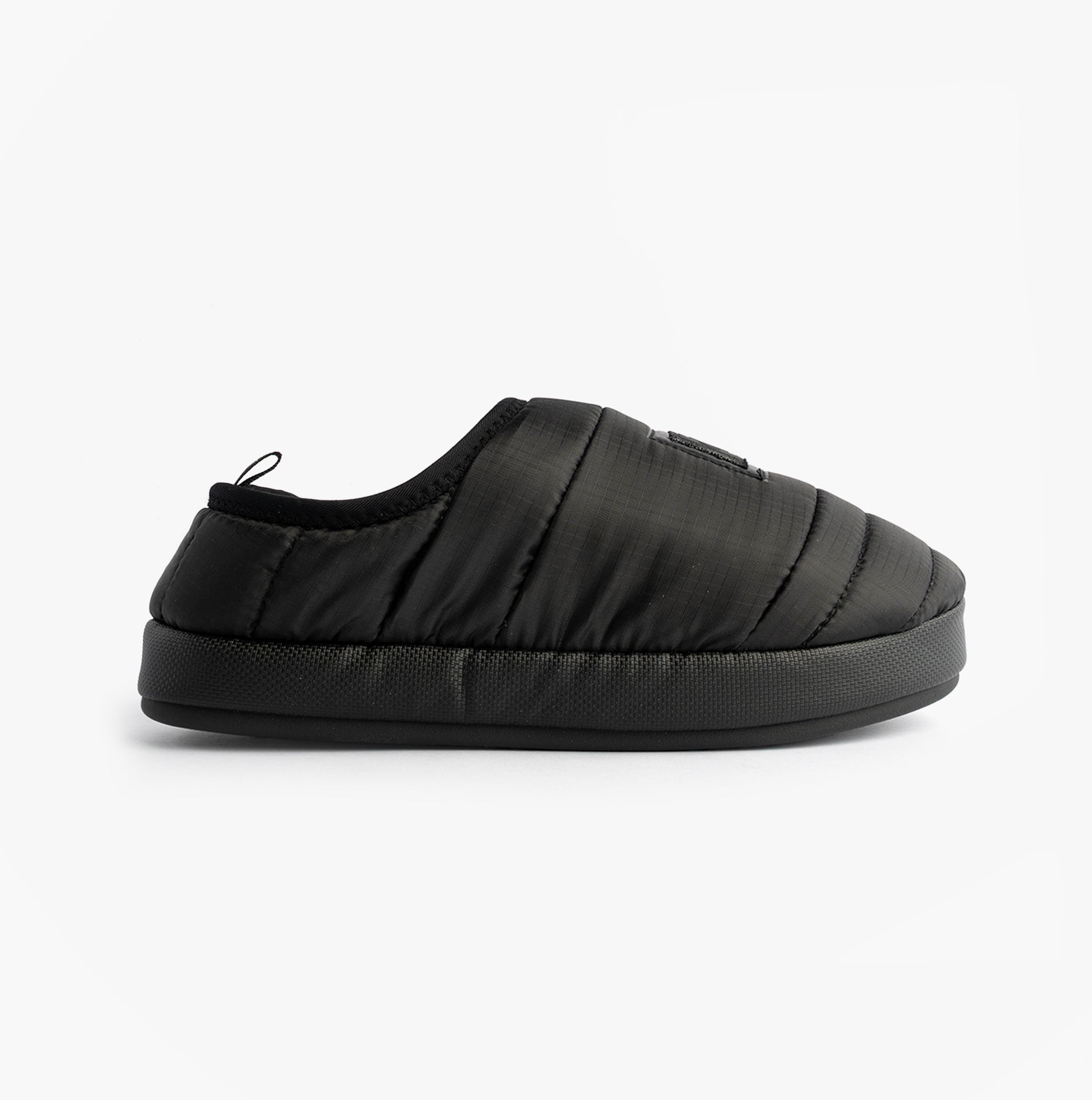 Calvin Klein HOME SLIPPER NYL PAT Womens Slippers Black side view showing lightweight polyester design and slip-on style.