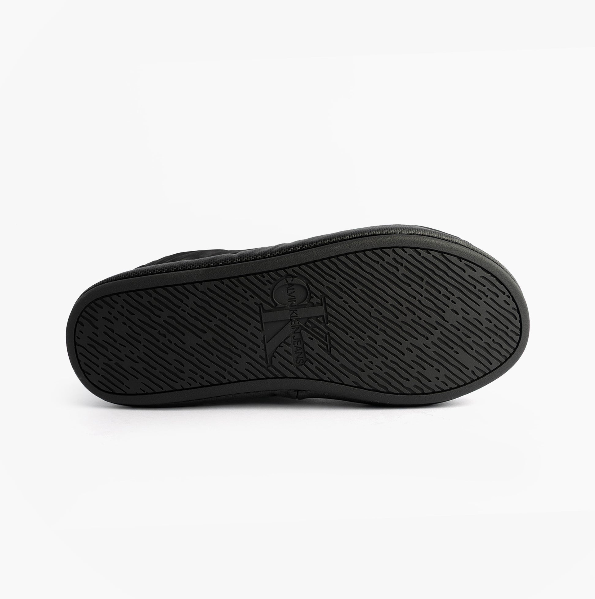 Calvin Klein HOME SLIPPER NYL PAT Womens Slippers Black bottom view showcasing sole design and texture.