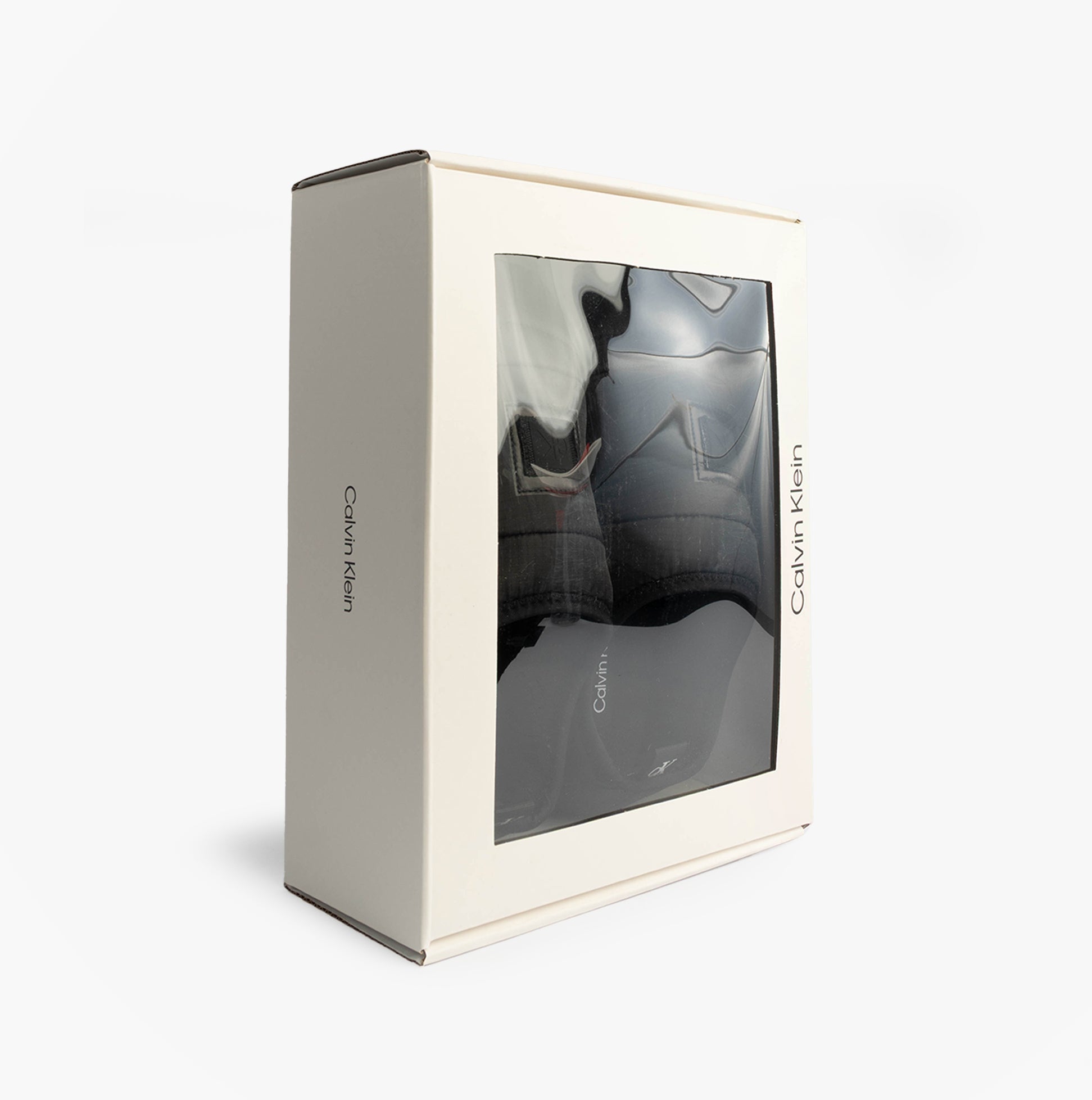 Calvin Klein HOME SLIPPER NYL PAT Womens Slippers Black boxed view showing packaging and slippers inside.