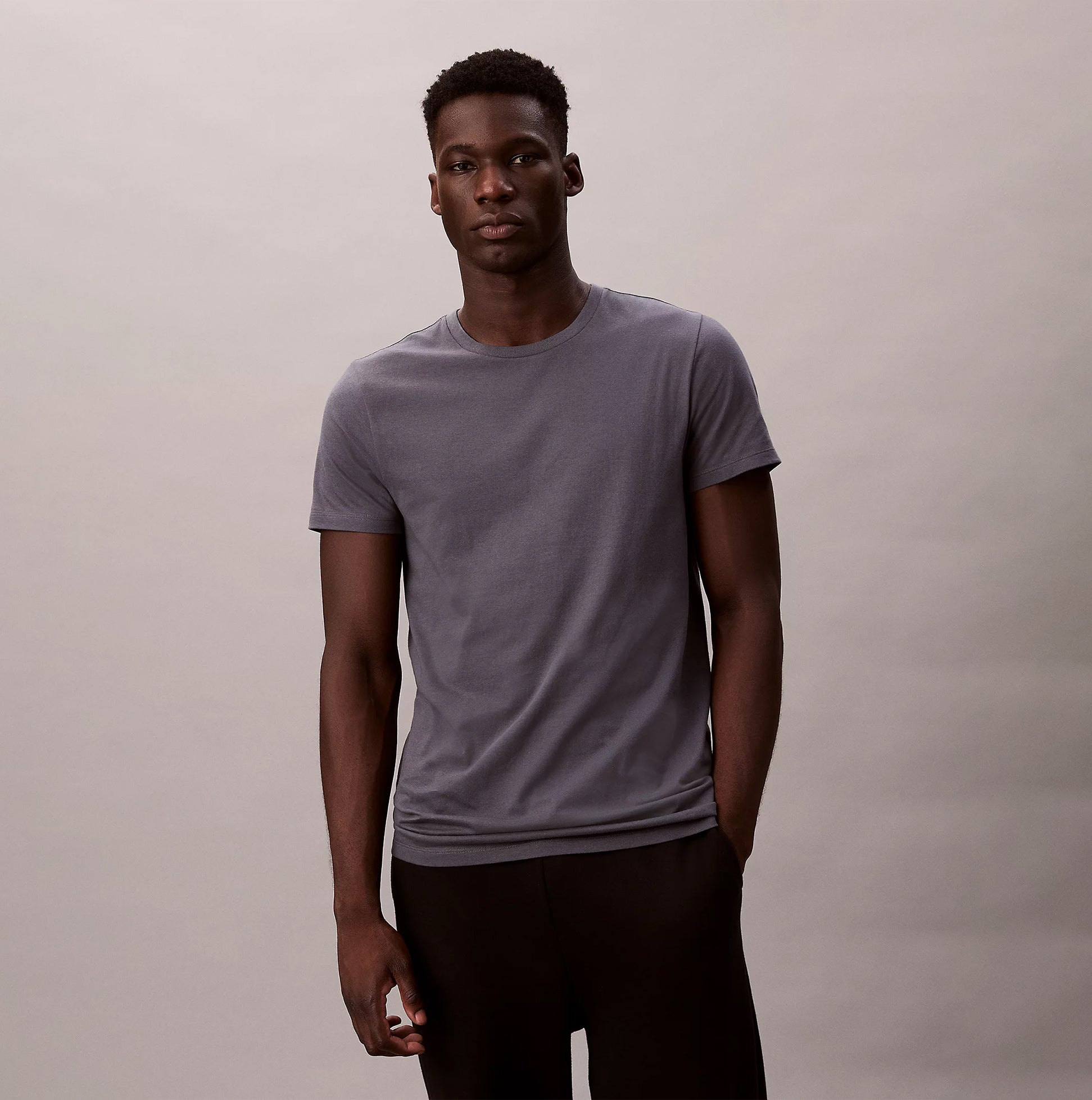 Calvin Klein S/S CREW NECK 3 PACK Mens T-Shirts & Tank Tops Multicoloured front view of a model wearing a grey t-shirt.