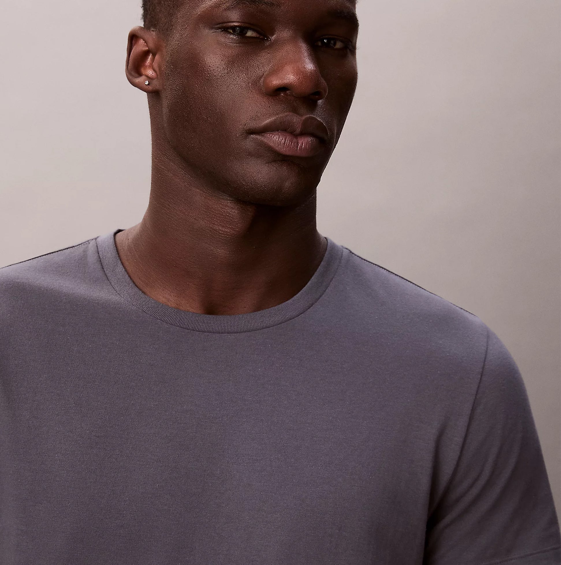 Calvin Klein S/S CREW NECK 3 PACK Mens T-Shirts & Tank Tops Multicoloured front view of model wearing gray cotton crew neck t-shirt.