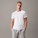 Calvin Klein 100% COTTON 3 Pack Mens T-Shirts Black/Grey Heather/White front view on model wearing white t-shirt.