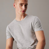 Calvin Klein 100% COTTON 3 Pack Mens T-Shirts Black/Grey Heather/White short sleeve gray t-shirt front view model wearing.