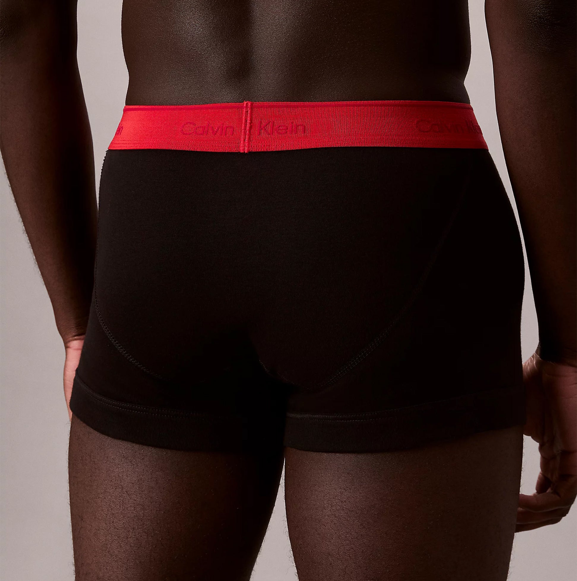 Calvin Klein TRUNK Mens 5 PACK Multicoloured back view showcasing black underwear with red waistband.