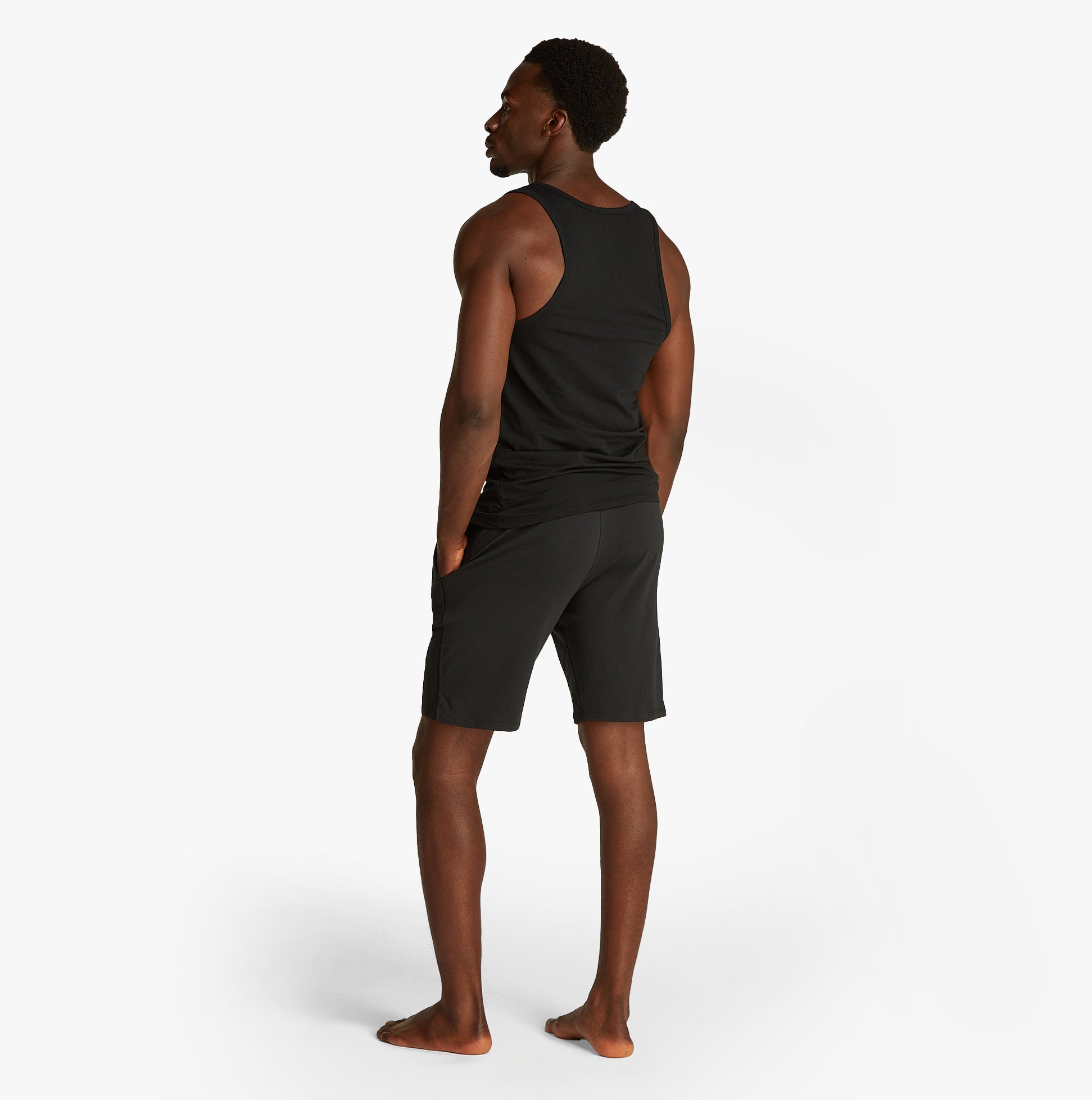 Calvin Klein 3 Pack Mens Lounge Tank Tops Black, back view of model wearing tank top and shorts, showcasing comfort and fit.