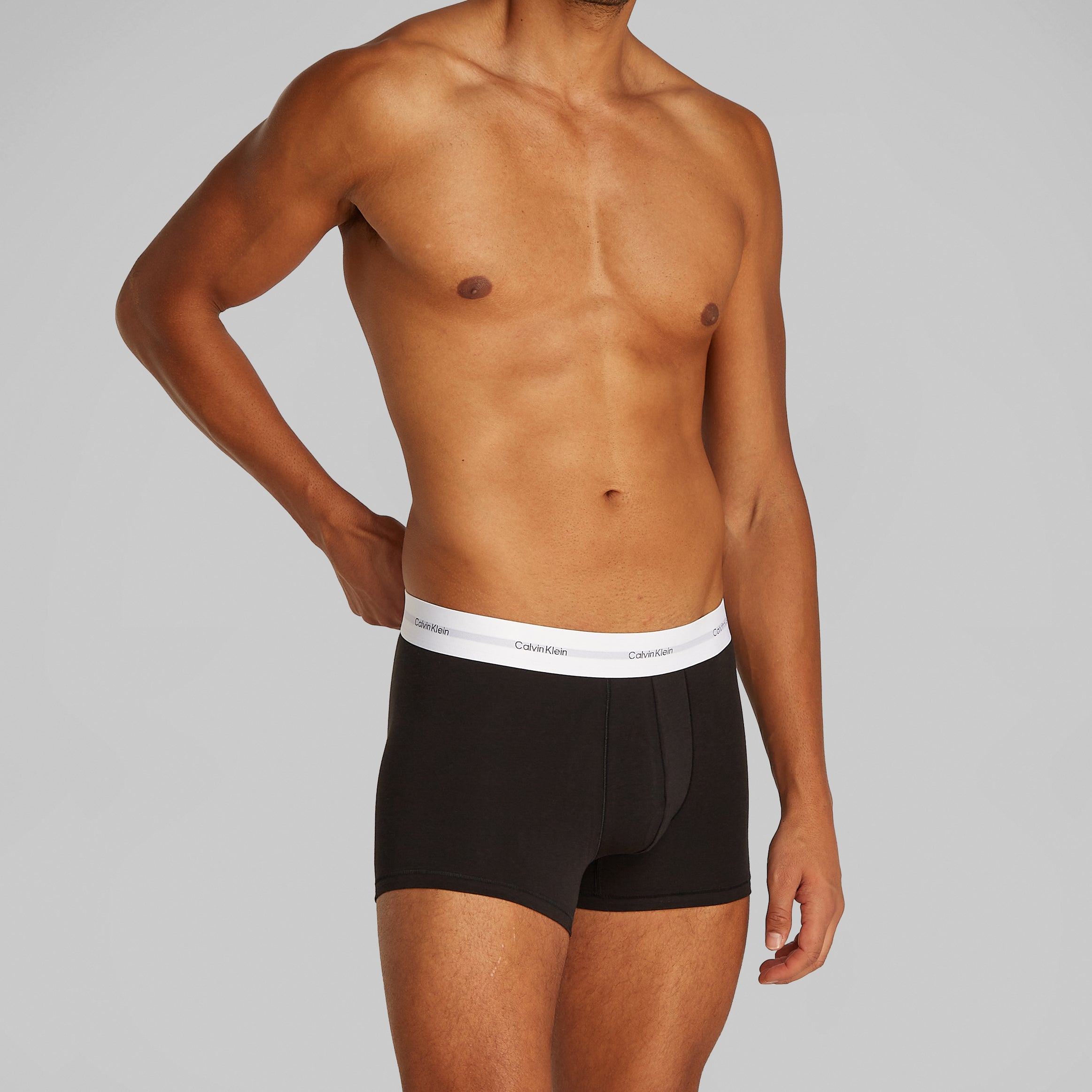 Calvin Klein COTTON 3 Pack Mens Trunks Black side view model wearing trunk with CK signature waistband