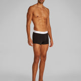 Calvin Klein COTTON 3 Pack Mens Trunks Black side view on model showcasing CK branded waistband.