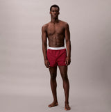 Calvin Klein BOXER SLIM 3 Pack Mens Cotton Stretch Multicoloured front view on model, showcasing red patterned design.