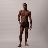 Calvin Klein RELAXED FIT Mens 3 Pack Trunks Multicoloured side view of model wearing black trunk underwear