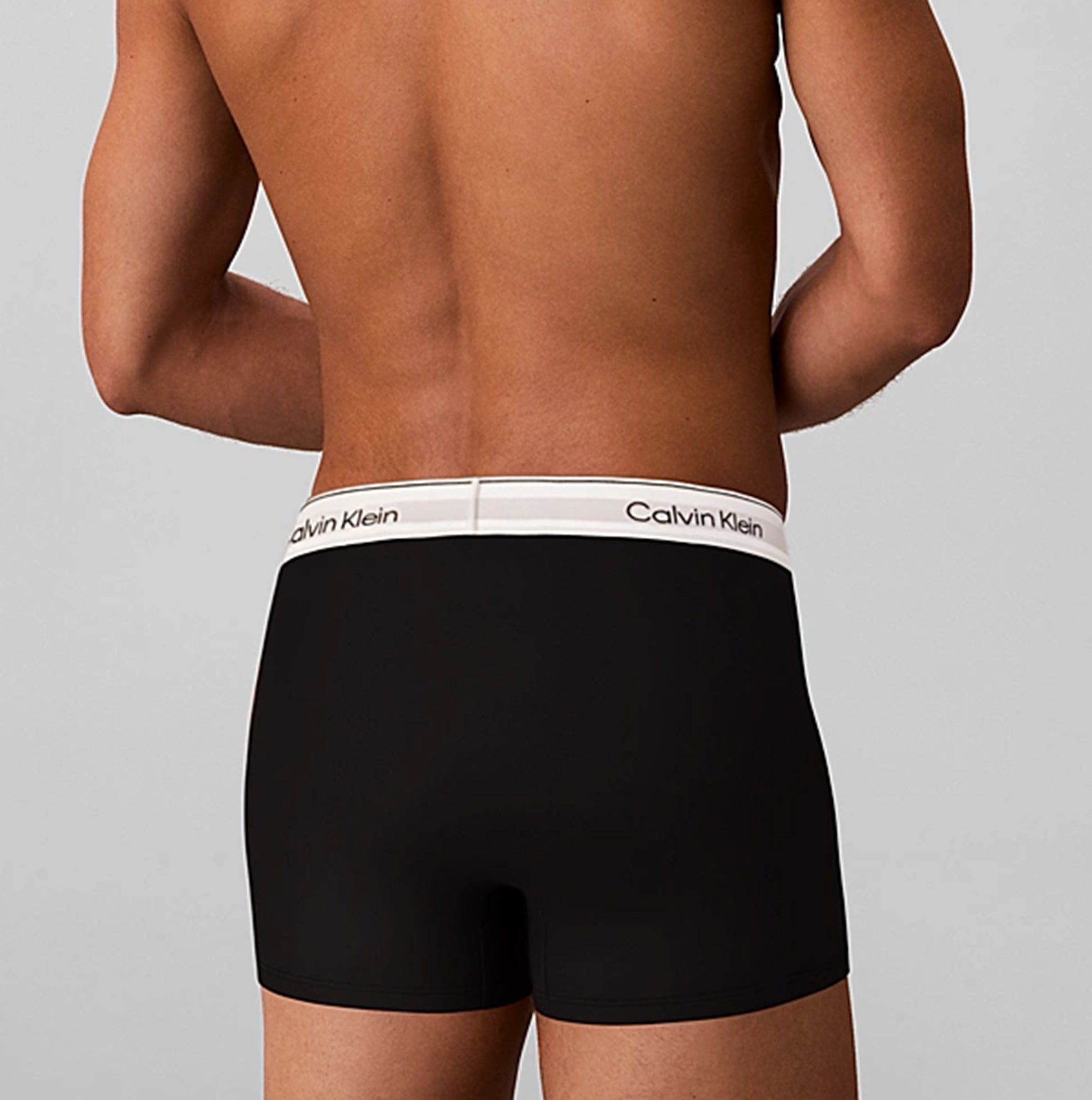 Calvin Klein COTTON BLEND Mens 3 Pack Trunks Multicoloured rear view of black trunks showing white logo waistband