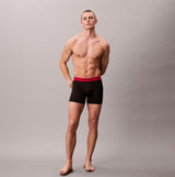 Calvin Klein BOXER BRIEF 3 Pack Mens Microfibre Stretch Black front view on model with red waistband