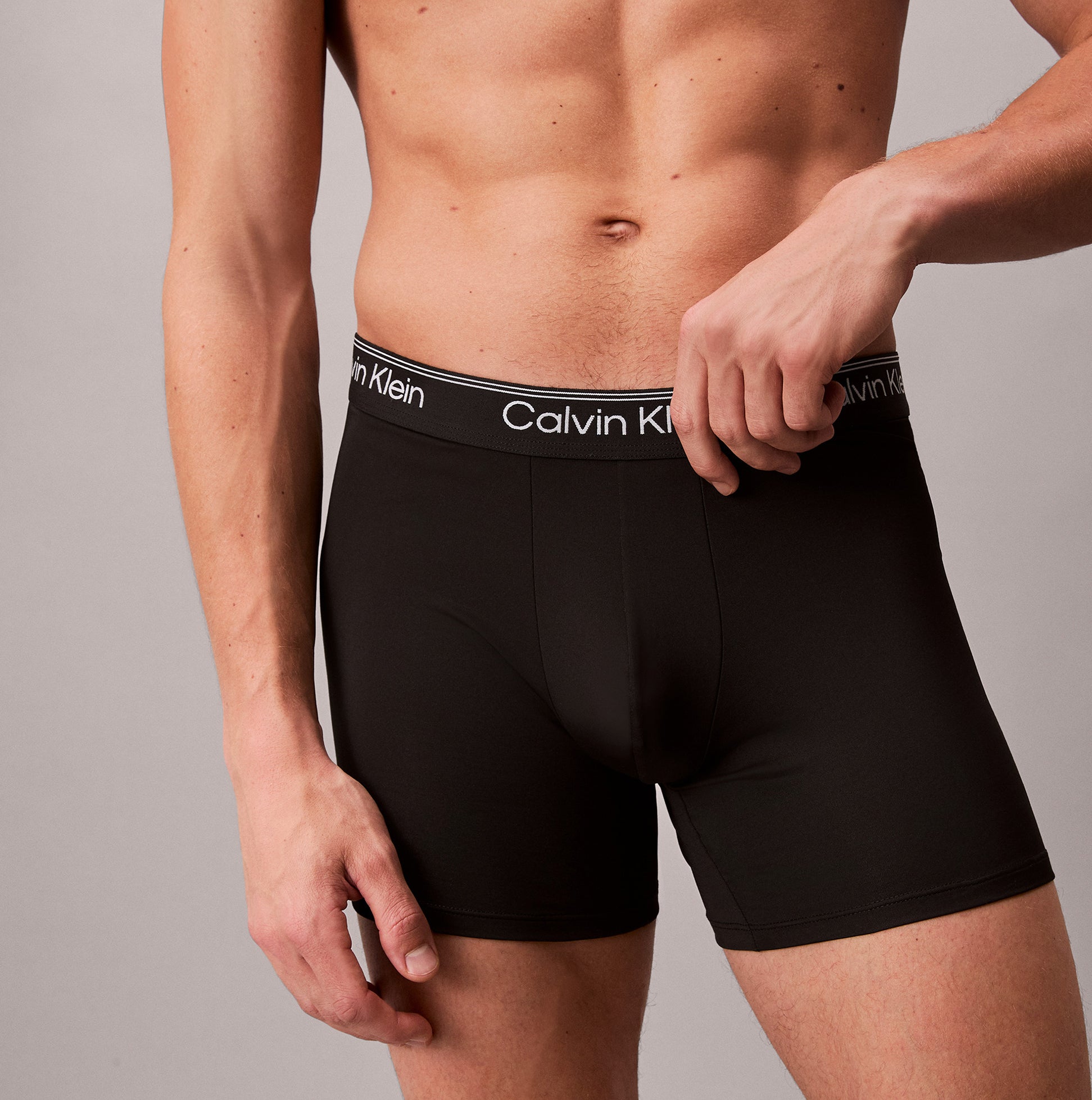 Calvin Klein BOXER BRIEF 3 Pack Mens Microfibre Stretch Black side view model wearing black boxer briefs.