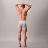 Calvin Klein TRUNK 3 PACK Mens Cotten Stretch Multicoloured back view of model wearing gray trunk underwear.