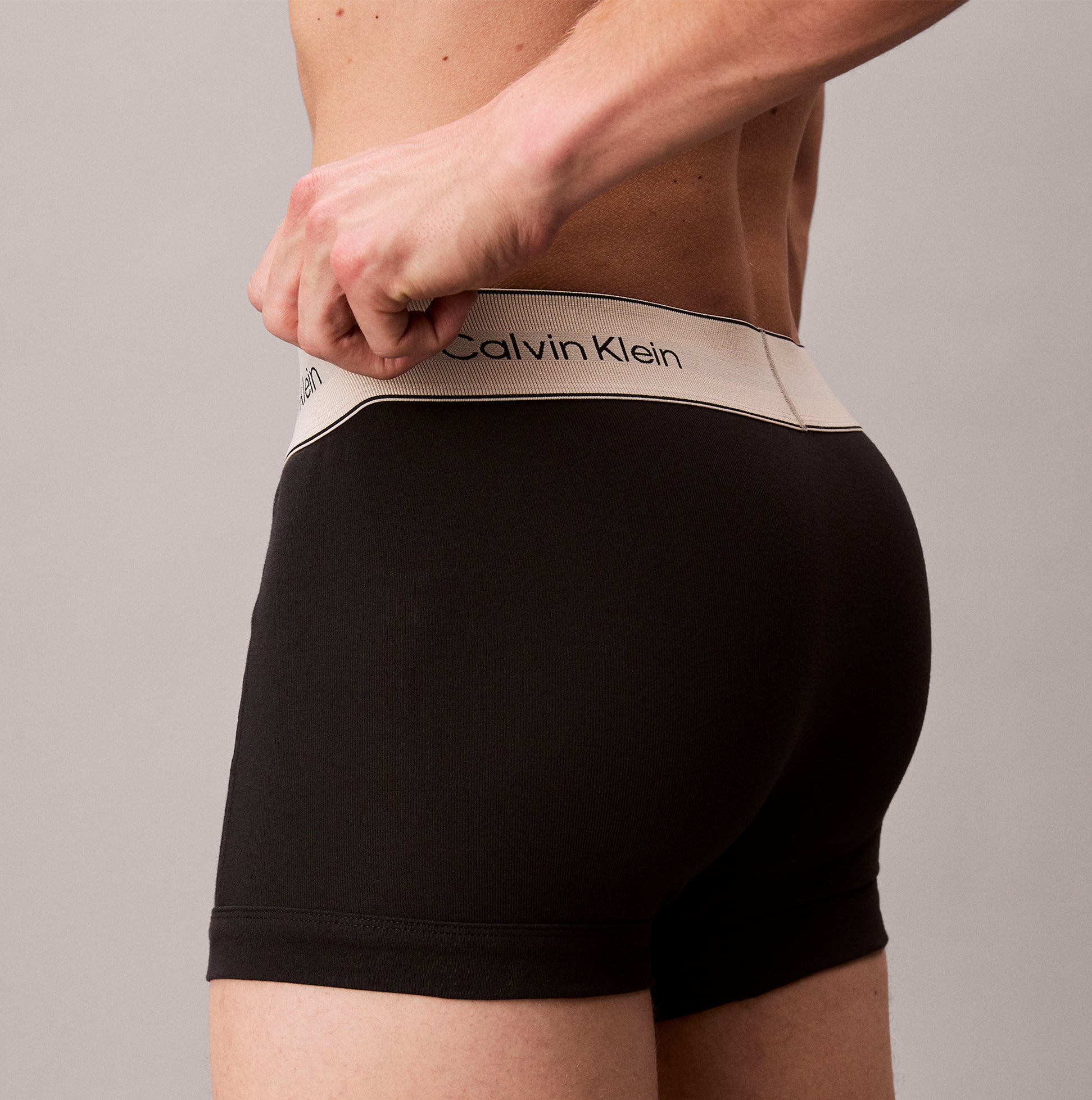 Calvin Klein TRUNK 3 Pack Mens Black side view showcasing flexible logo waistband and contoured pouch.