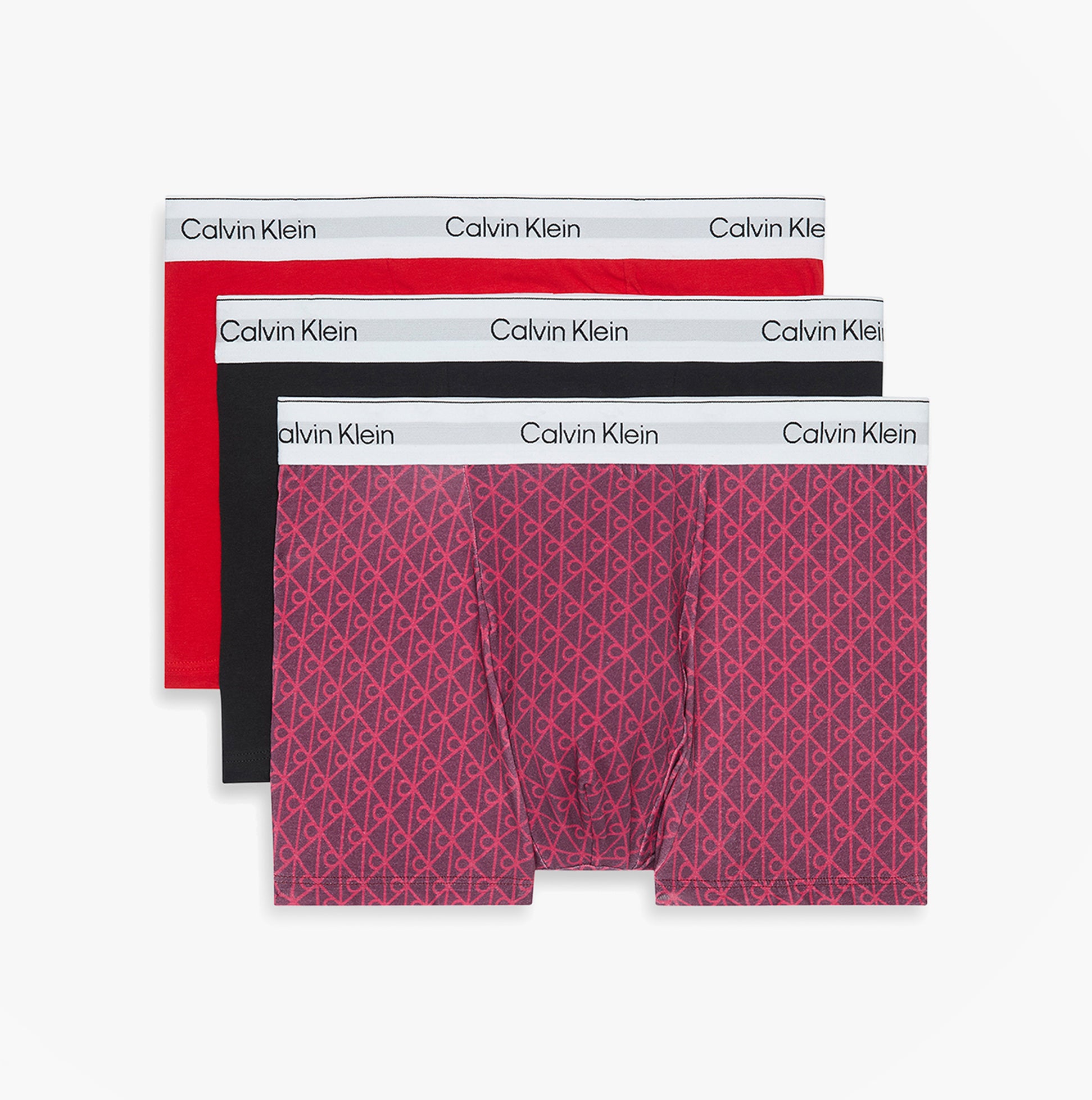 Calvin Klein RELAXED FIT 3 Pack Mens Trunks Multicoloured front view showing red, black, and patterned designs.
