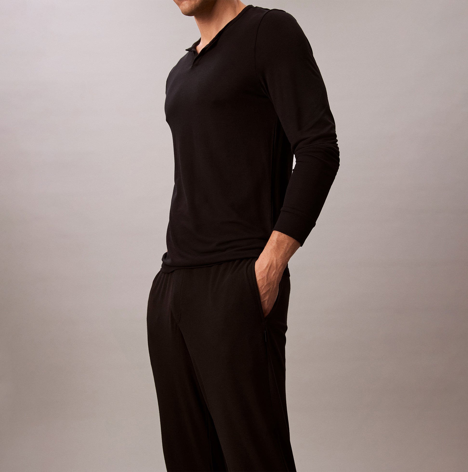 Calvin Klein ULTRA SOFT MODAL Mens Lounge Bottoms Black side view on model showing comfort and pockets.