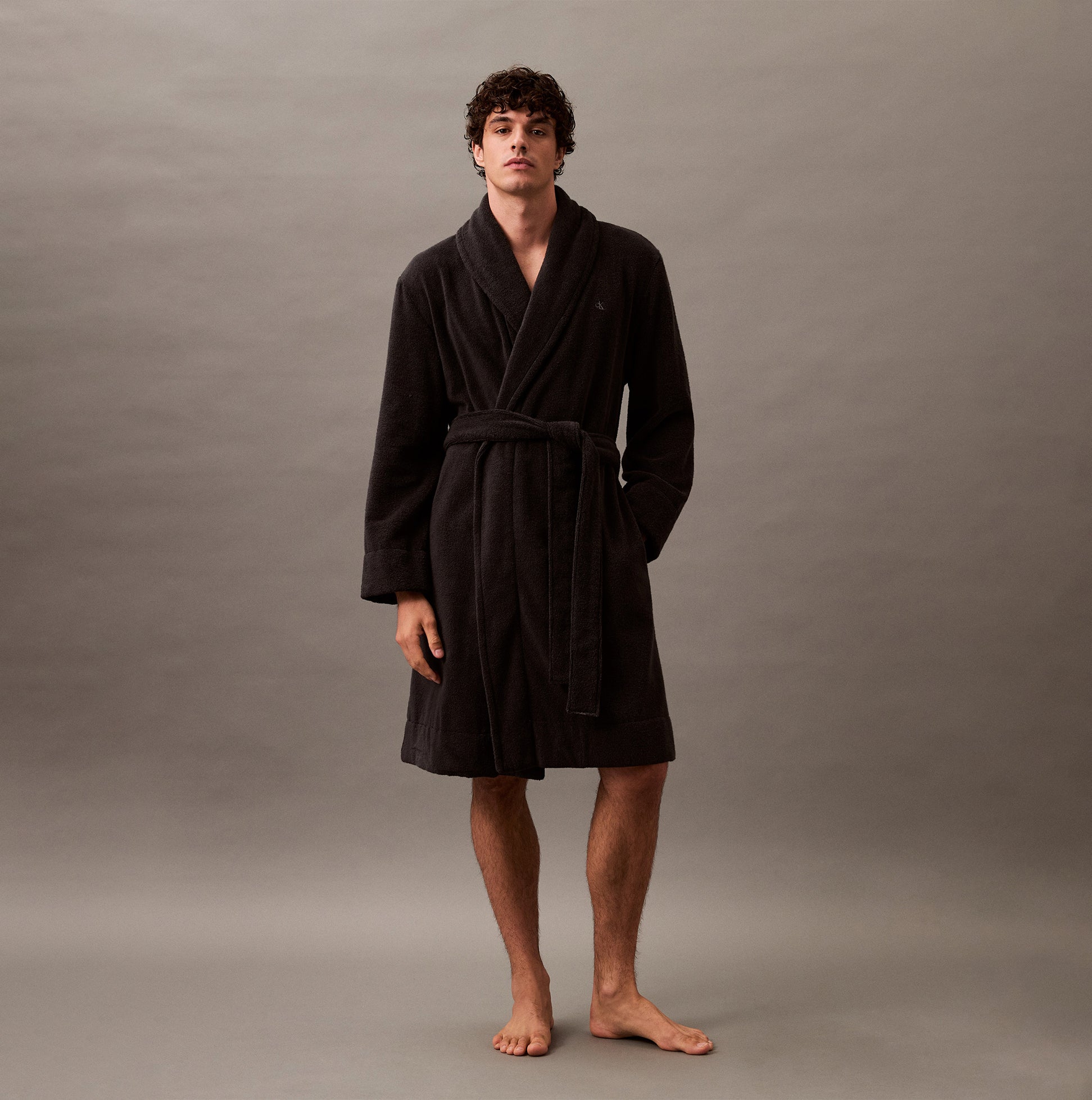 Calvin Klein COMFORT FRENCH TERRY Mens Bathrobes Black front view on model, showcasing soft cotton fabric and long sleeves.