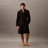 Calvin Klein COMFORT FRENCH TERRY Mens Bathrobes Black front view on model, showcasing soft cotton fabric and long sleeves.