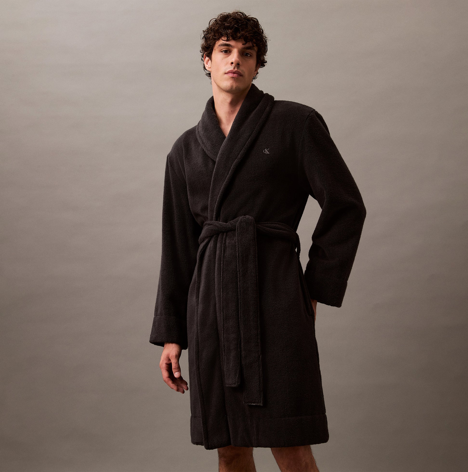 Calvin Klein COMFORT FRENCH TERRY Mens Bathrobes Black front view on model, showcasing soft 100% cotton fabric and long sleeves.