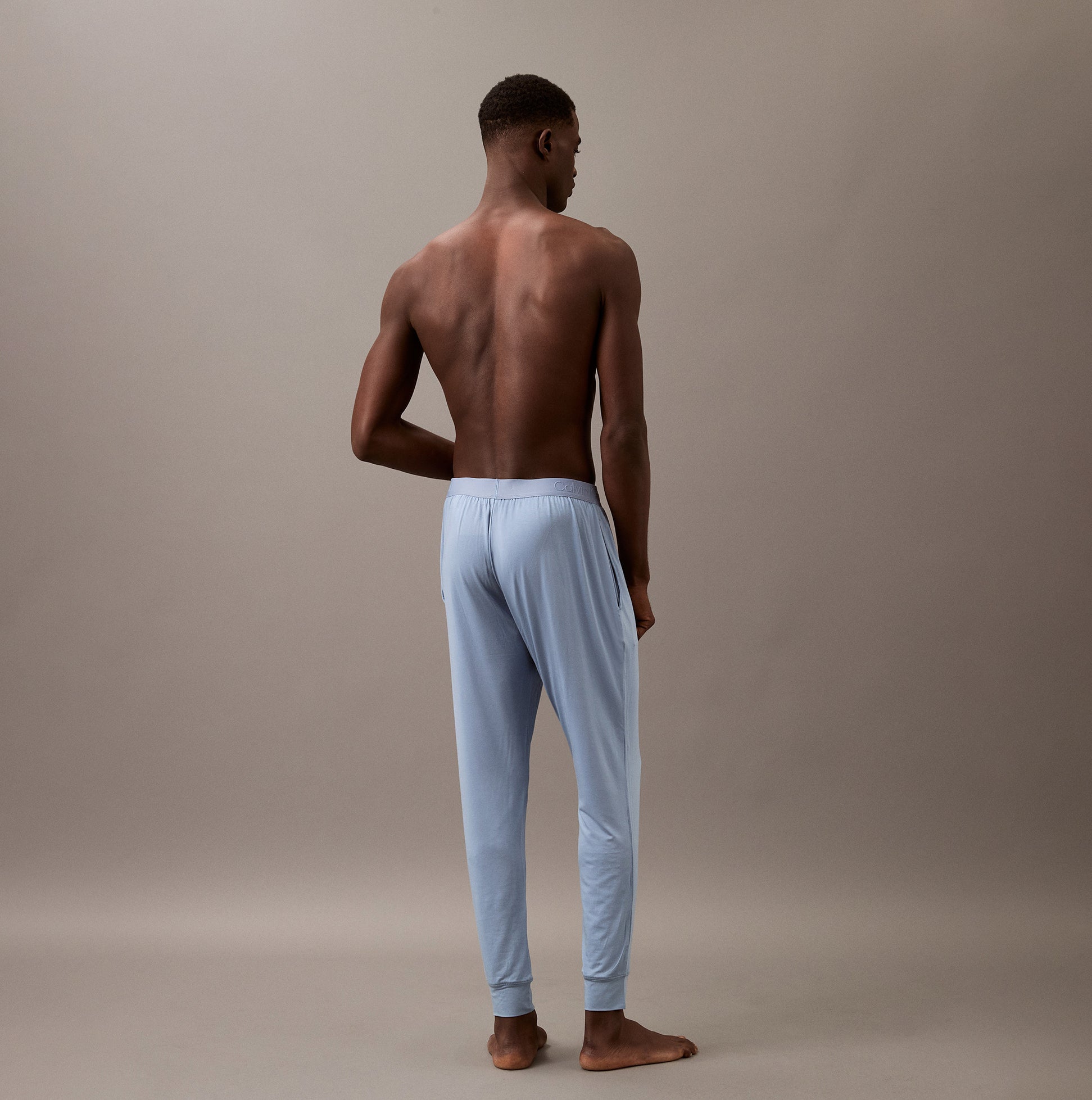 Calvin Klein ULTRA SOFT MODAL Mens Lounge Joggers Faded Denim back view on model.