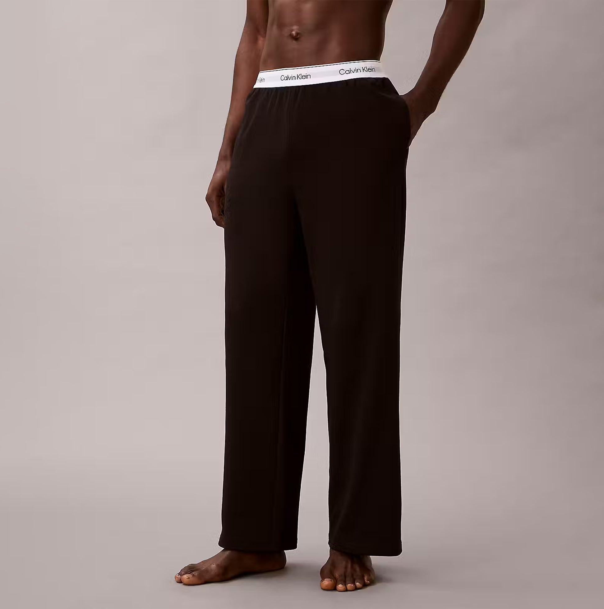 Calvin Klein LS TEE PANT SET Mens Black side view of pants with logo waistband on display.
