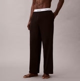 Calvin Klein LS TEE PANT SET Mens Black side view of pants with logo waistband on display.
