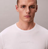 Calvin Klein LS TEE PANT SET Mens Multicoloured front view featuring a model wearing a white Calvin Klein t-shirt with embossed logo.