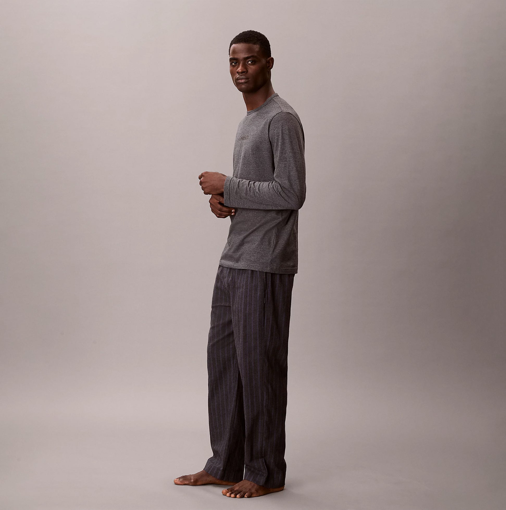 Calvin Klein LS TEE PANT SET Mens Multicoloured side view model wearing long sleeve tee and pants.