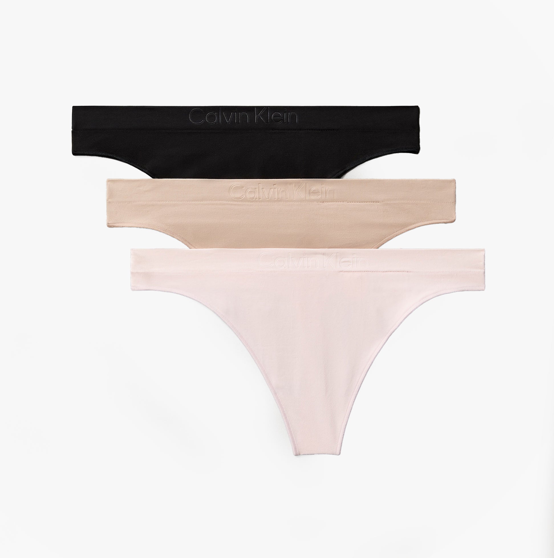 Calvin Klein Bonded Flex Seamless Womens 3 Pack Thong Multi, side view showcasing black, nude, and pink thongs.