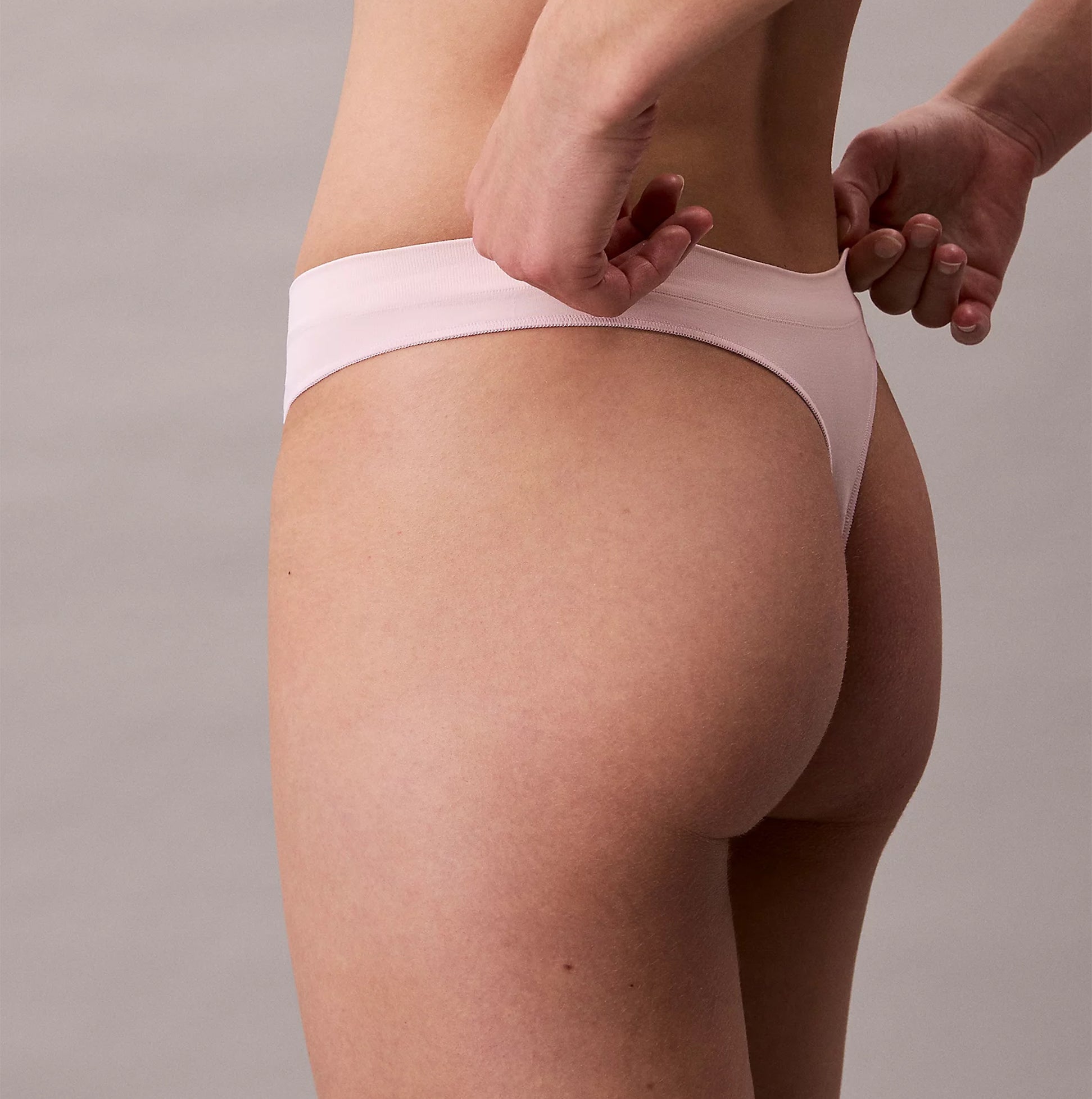 Calvin Klein Bonded Flex Seamless Womens 3 Pack Thong Multi side view showcasing pink thong underwear fit and style.
