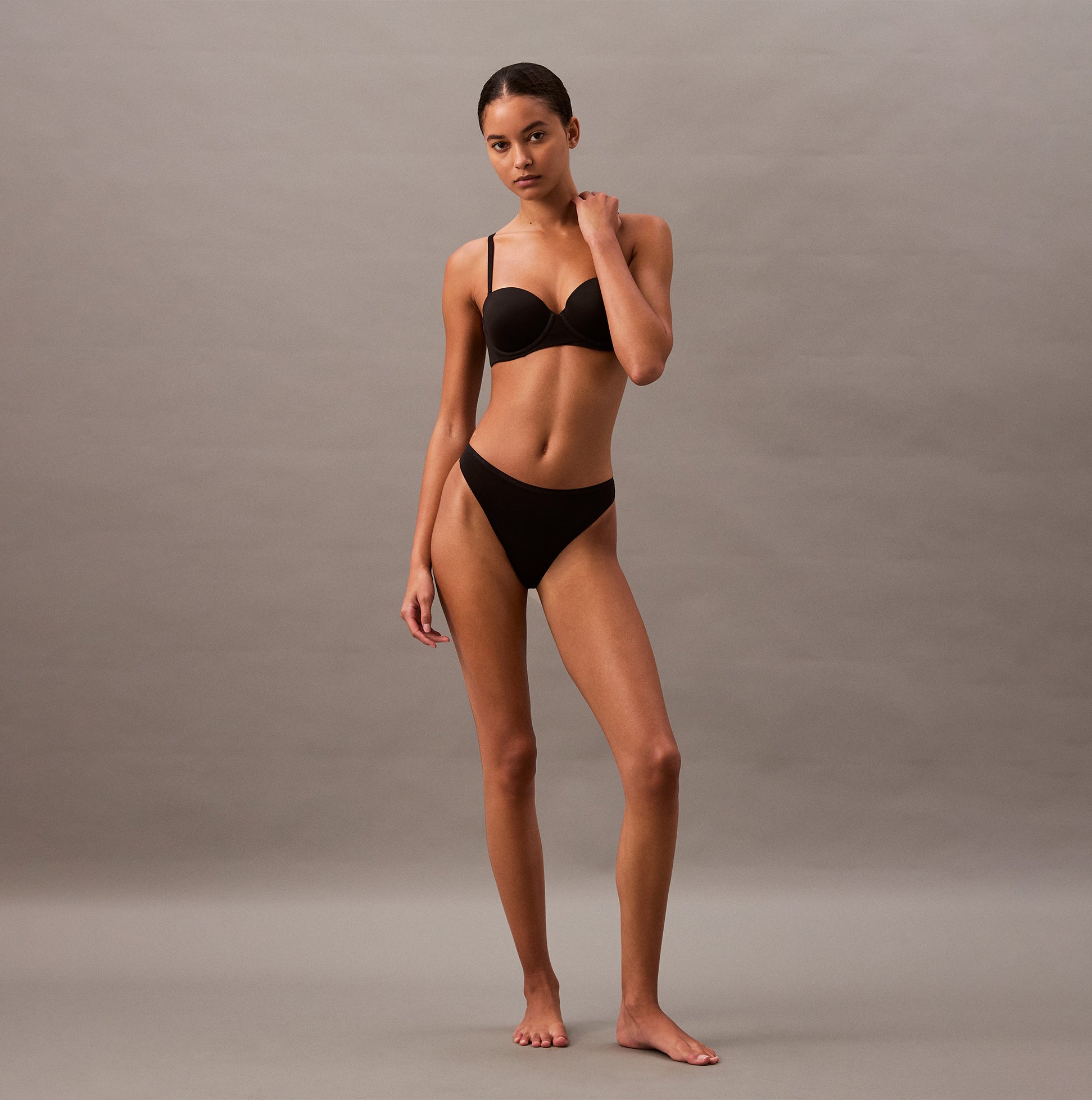 Calvin Klein THONG Womens Perfect Fit Black front view model wearing underwear, showcasing sleek fit and style.