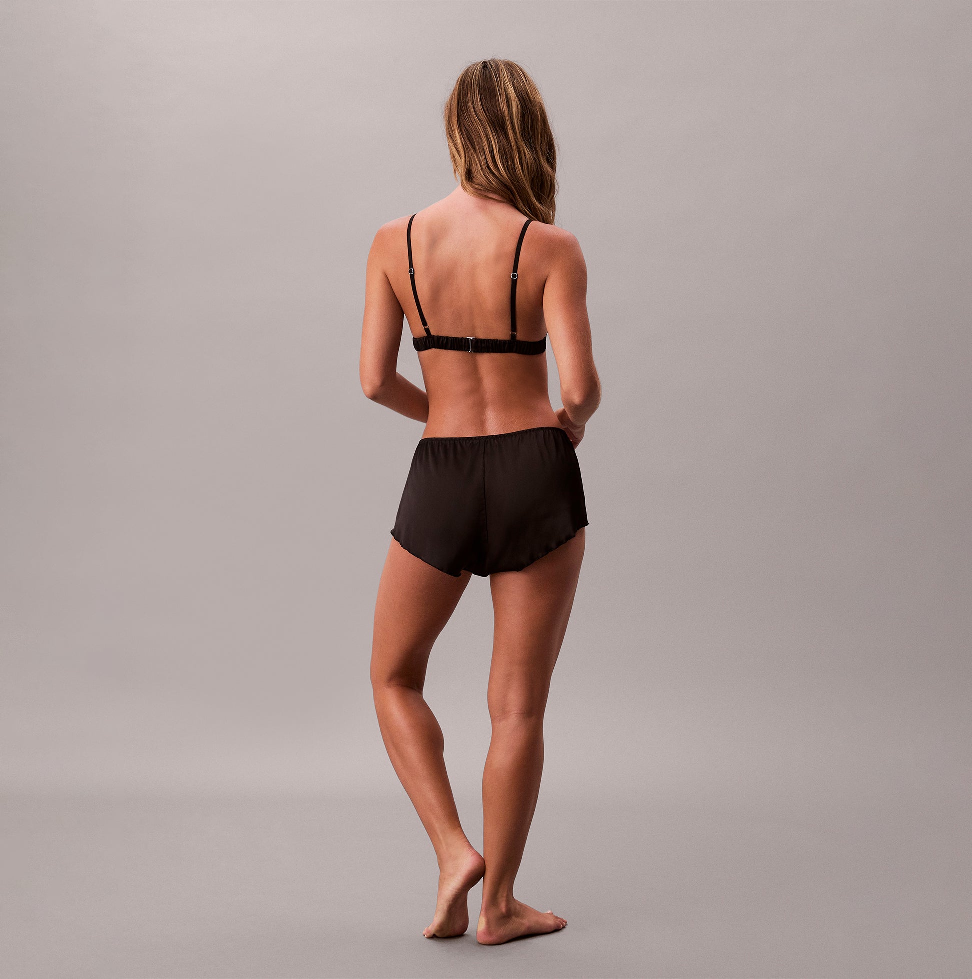 Calvin Klein TAPSHORT Womens Shorts Black back view model wearing shorts