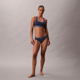Calvin Klein Icon Cotton Modal Womens Unlined Bralette Denim front view, featuring a model wearing the bralette and matching lingerie.