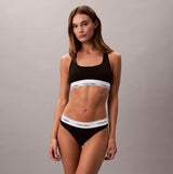 Calvin Klein Icon Cotton Modal Womens Unlined Bralette Black front view showing model wearing bralette with logo band.