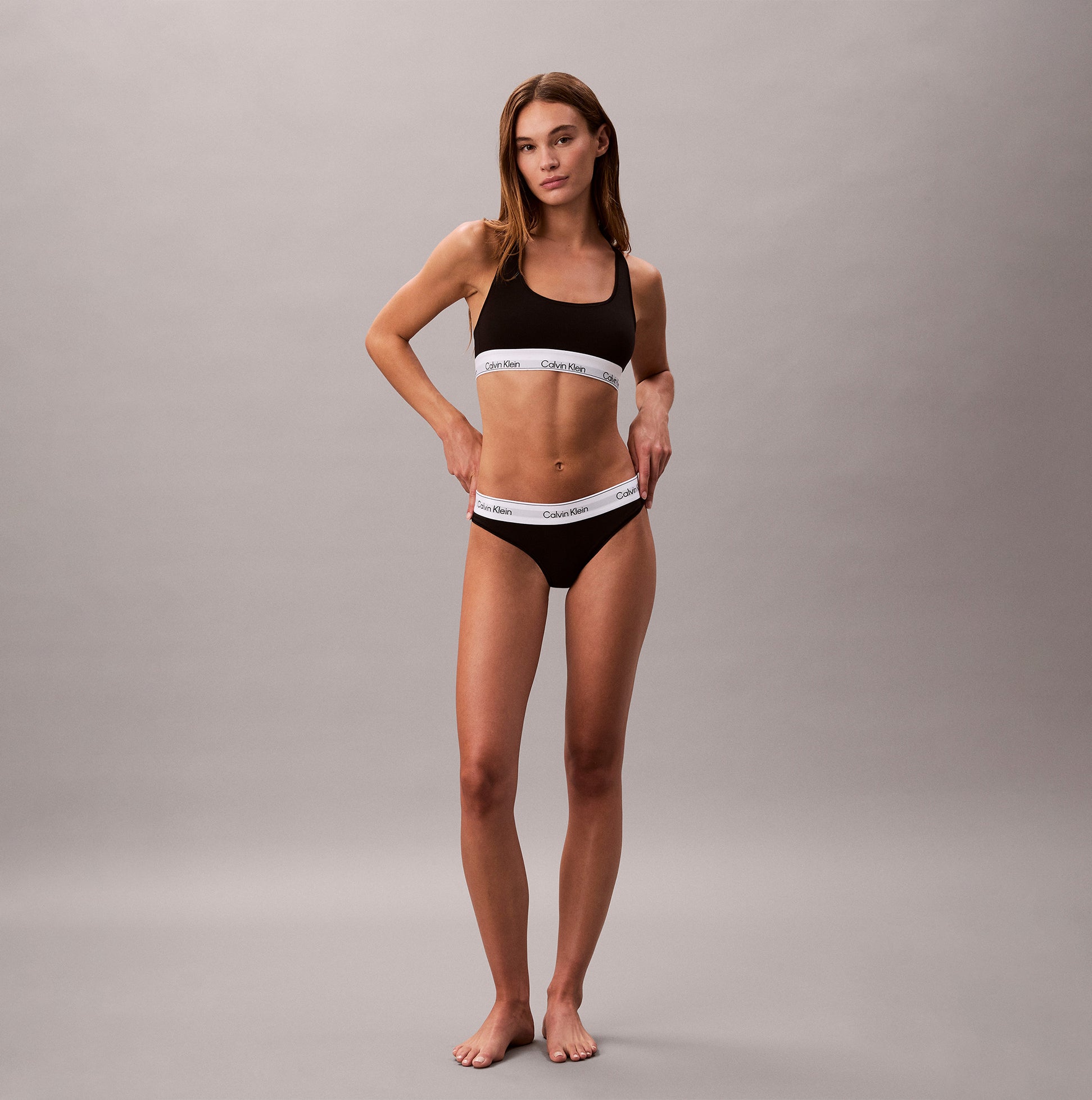 Calvin Klein Icon Cotton Modal Womens Unlined Bralette Black front view on model wearing matching underwear.