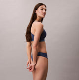 Calvin Klein Icon Cotton Modal Womens Thong Denim side view model wearing blue thong underwear