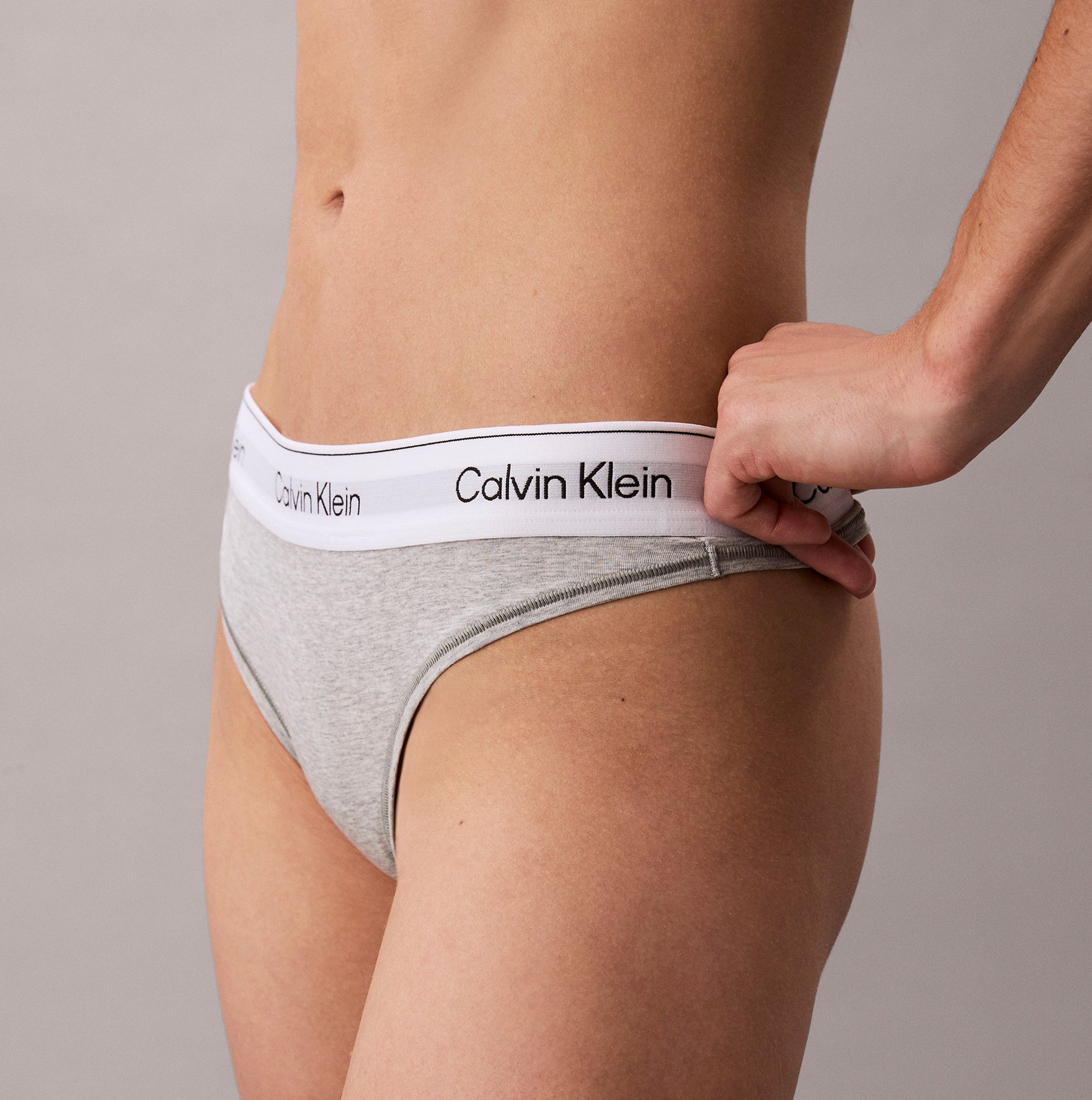 Calvin Klein Icon Cotton Modal Womens Thong Grey side view showcasing the soft fabric and logo waistband.