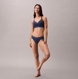 Calvin Klein Icon Cotton Modal Womens Bikini Brief Denim front view on model showcasing fit and style.