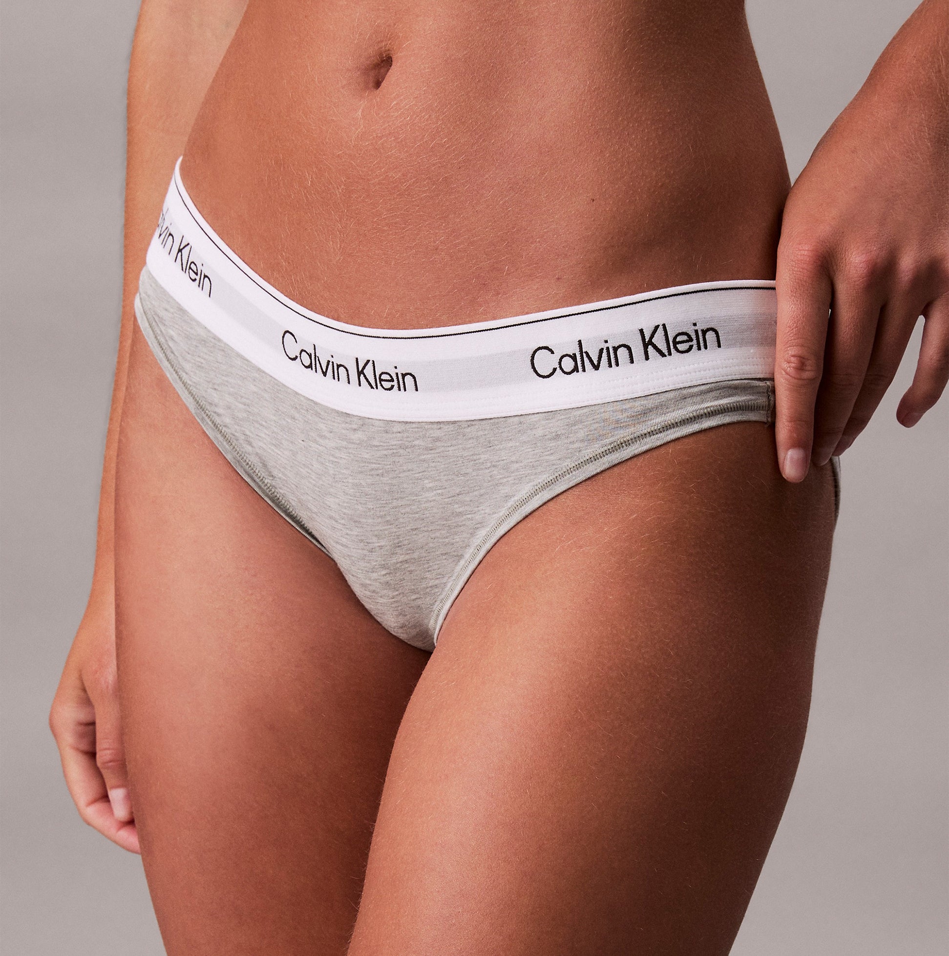 Calvin Klein Icon Cotton Modal Womens Bikini Brief Grey side view, showcasing the iconic logo and soft fabric details.