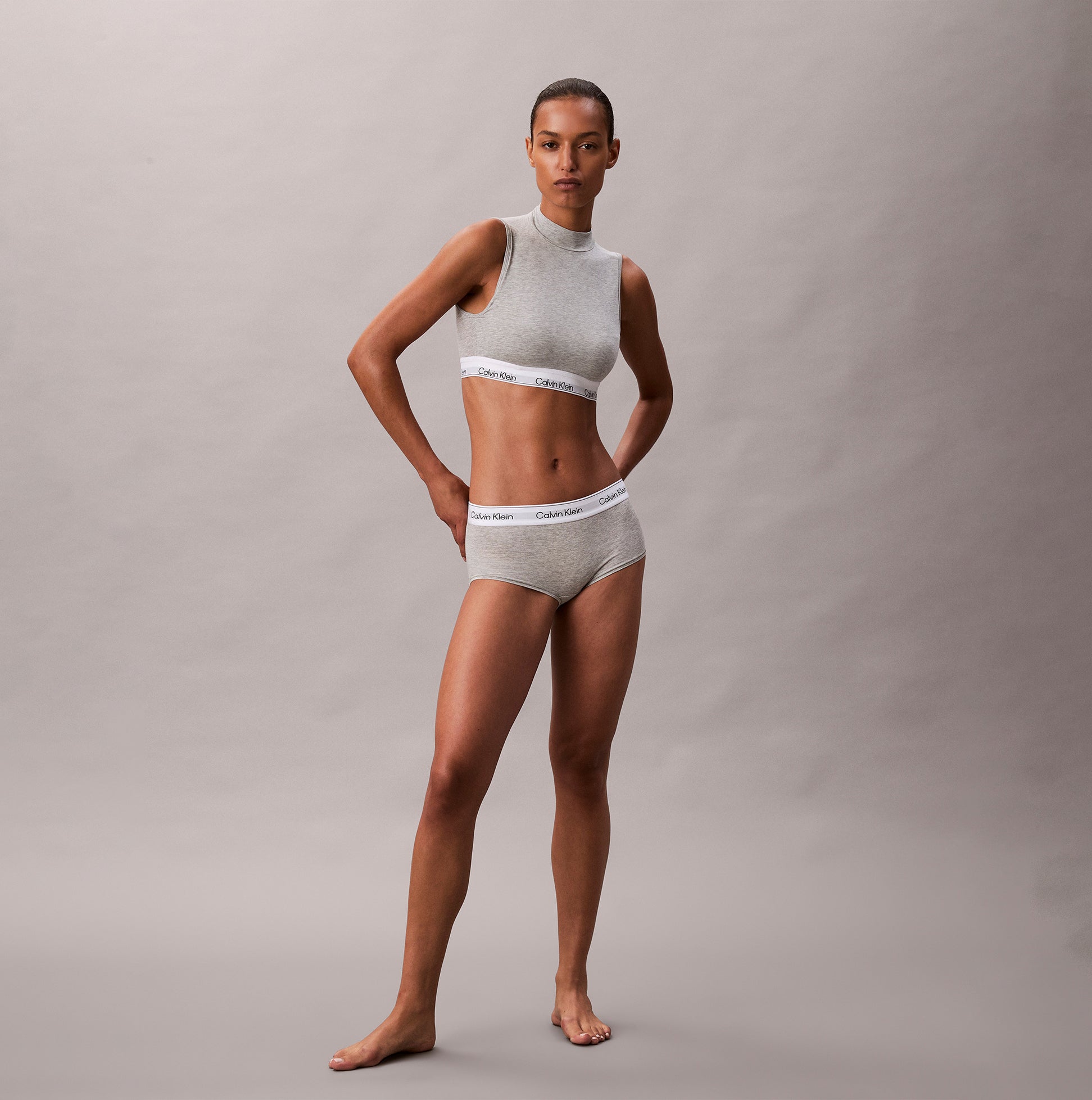Calvin Klein Icon Cotton Modal Womens Boy Shorts Grey side view model wearing matching grey set with logo waistband.
