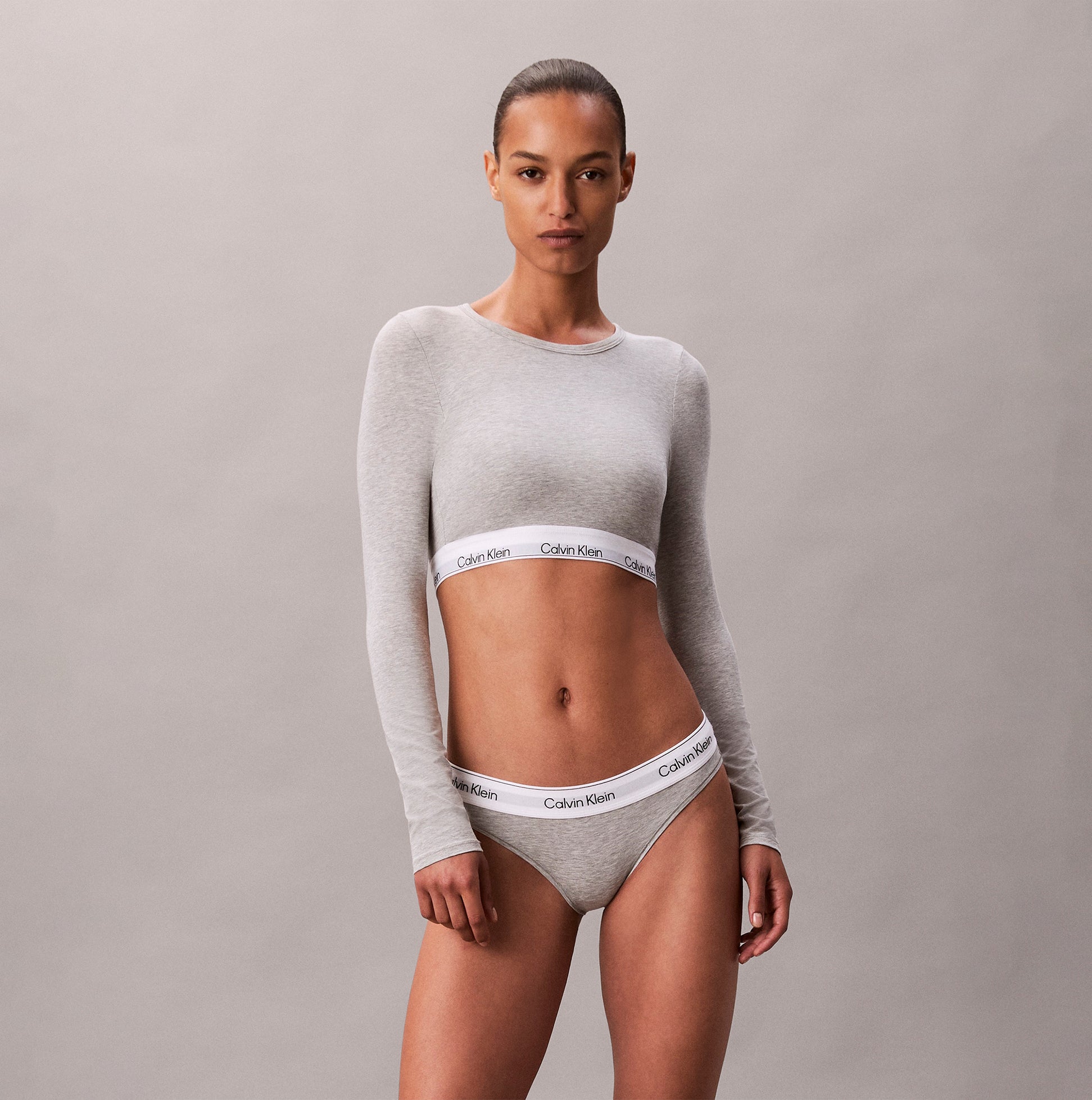 Calvin Klein Icon Cotton Modal Womens Long Sleeve T-shirt Bralette Grey front view on model, showcasing comfortable fit and branding.