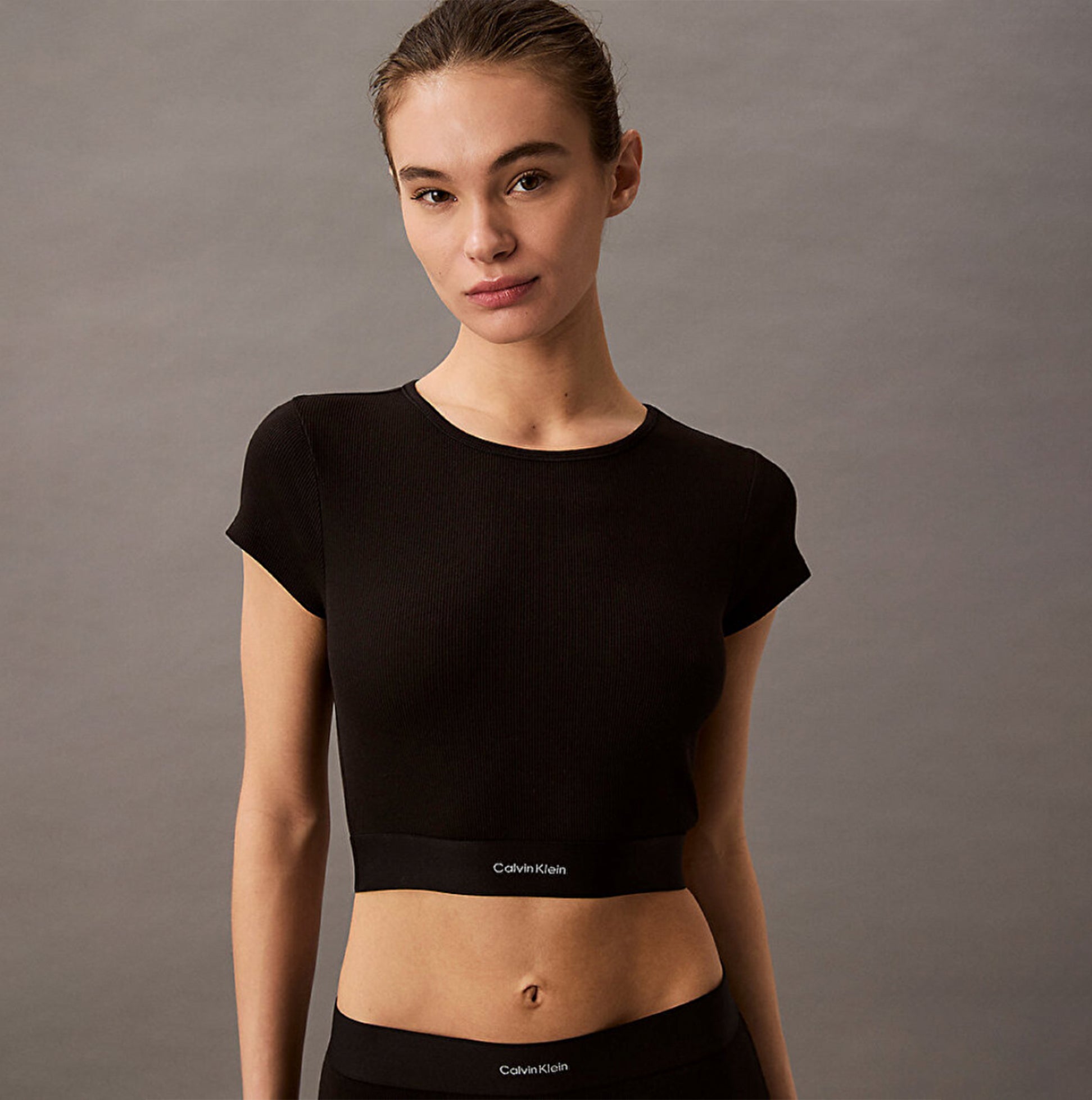 Calvin Klein COTTON STRETCH RIB Womens Crop Top Black front view showcasing fine ribbed texture and crew neckline.