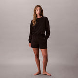 Calvin Klein Womens Long Sleeve Pyjama Top Black front view on model with black shorts, stylish and comfortable sleepwear.