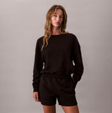 Calvin Klein Womens Long Sleeve Pyjama Top Black front view, showcasing relaxed fit and comfortable style.