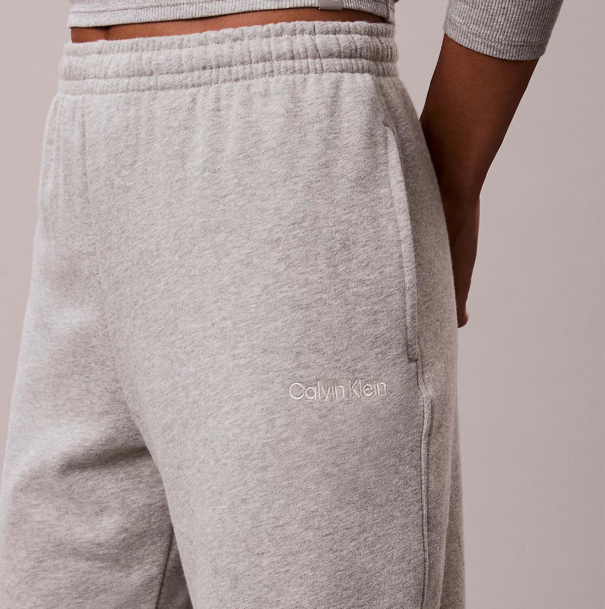 Calvin Klein JOGGER Womens Grey Heather side view showing detail of fabric and logo on pocket.