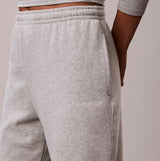 Calvin Klein JOGGER Womens Grey Heather side view showing detail of fabric and logo on pocket.